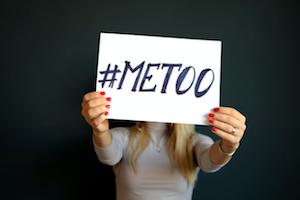 Woman holding up a #MeToo Poster